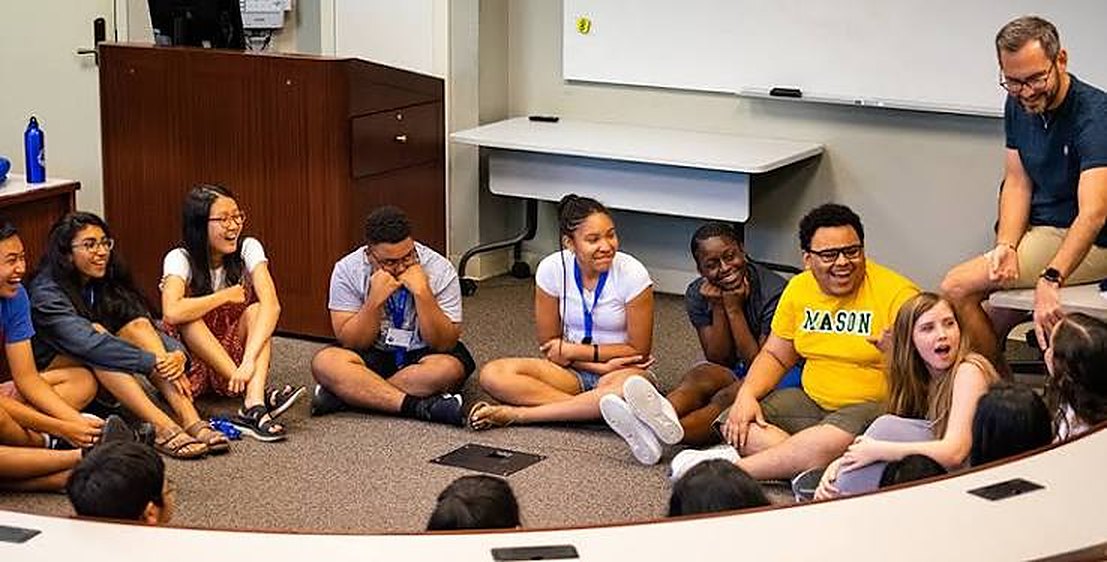 Students seated in a circle during a coaching workshop